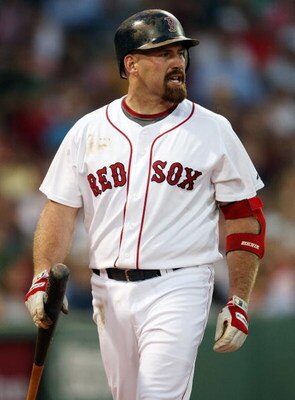 BOSTON - JULY 06:  Kevin Youkilis #20 of the Boston Red Sox reacts after he struck out against the Oakland Athletics on July 6, 2009 at Fenway Park in Boston, Massachusetts. The Athletics defeated the Red Sox 6-0. (Photo by Elsa/Getty Images)