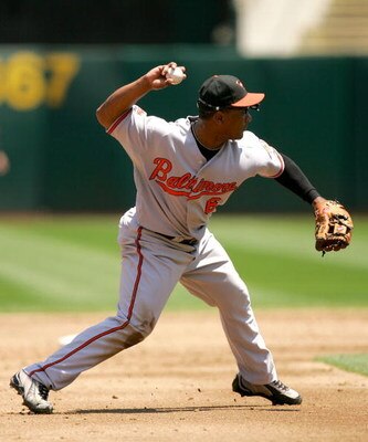 OAKLAND, CA - JUNE 07:  Melvin Mora #6 of the Baltimore Orioles throws to first base during their game against the Oakland Athletics at the Oakland Coliseum on June 7, 2009 in Oakland, California.  (Photo by Ezra Shaw/Getty Images)