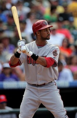 DENVER - JULY 05:  Outfielder Chris Young #24 of the Arizona Diamondbacks takes an at bat against the Colorado Rockies during MLB action at Coors Field on July 5, 2009 in Denver, Colorado. The Diamondbacks defeated the Rockies 4-3.  (Photo by Doug Pensing