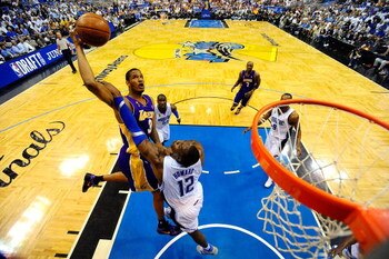 ORLANDO, FL - JUNE 14: Trevor Ariza #3 of the Los Angeles Lakers goes to the basket against Dwight Howard #12 of the Orlando Magic in Game Five of the 2009 NBA Finals on June 14, 2009 at Amway Arena in Orlando, Florida.  NOTE TO USER:  User expressly ackn
