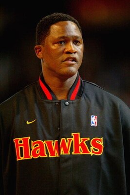 ATLANTA - FEBRUARY 8:  Dominique Wilkins of the Atlanta Team looks on before the Jeep Hoop it Up Game during the 2003 NBA All Star weekend at Philips Arena on February 8, 2003 in Atlanta, Georgia.  NOTE TO USER: User expressly acknowledges and agrees that