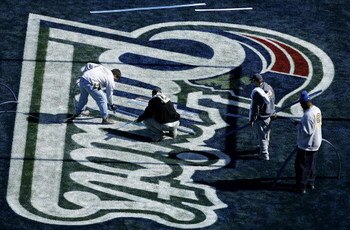 JACKSONVILLE, FL-  JANUARY 31: Members of the grounds crew paint the New England Patriots logo on the field prior to the start of Super Bowl XXXIX at Alltel Stadium on January 31, 2005 in Jacksonville, Florida. (Photo by Scott Halleran/Getty Images)