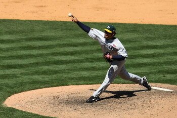 NEW YORK - JULY 13:  Henry Rodriguez #18 of the Oakland A's playing for the World Futures Team pitches against the United States Olympic Team during the 2008 XM All-Star Futures Game at Yankee Stadium on July 13, 2008 in the Bronx borough of New York City