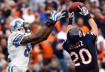 CHICAGO - NOVEMBER 02:  Craig Steltz #20 of the Chicago Bears intercepts a pass intended for Calvin Johnson #81 of the Detroit Lions during the fourth quarter at Soldier Field on November 2, 2008 in Chicago, Illinois. The Bears defeated the Lions 27-23.  