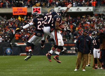 CHICAGO - NOVEMBER 09:  (L-R) Devin Hester #23, Kevin Jones #27 and Matt Forte #22 of the Chicago Bears celebrate after Forte scored a on 5-yard touchdown reception in the first quarter against the Tennessee Titans at Soldier Field on November 9, 2008 in 