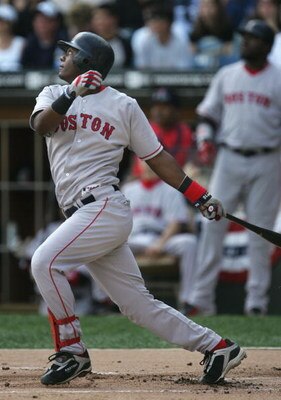 CHICAGO - OCTOBER 4:  Short stop Edgar Renteria #3 of the Boston Red Sox hits a double against the Chicago White Sox during the first inning of Game 1 of the American League Division Series at U.S. Celluar Field on October 4, 2005 in Chicago, Illinois.  