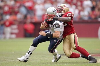 SAN FRANCISCO - OCTOBER 5:  Quarterback Matt Cassel #16 of the New England Patriots is sacked by Patrick Willis #52 of the San Francisco 49ers during an NFL game on October 5, 2008 at Monster Park in San Francisco, California. 