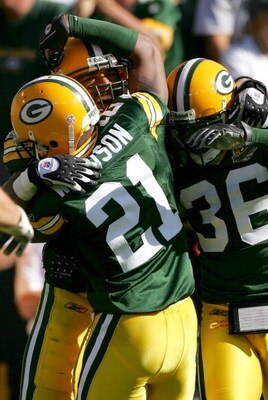 GREEN BAY, WI - SEPTEMBER 23:  Nick Barnett #56 of the Green Bay Packers is congratulated by teammates Charles Woodson #21 and Nick Collins #36 after catching an interception late in the fourth quarter against the San Diego Chargers at Lambeau Field Septe
