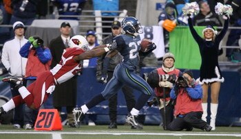 SEATTLE - DECEMBER 9:  Cornerback Marcus Trufant #23 of the Seattle Seahawks returns an interception for a touchdown against J. J. Arrington #28 of the Arizona Cardinals at Qwest Field December 9, 2007 in Seattle, Washington. The Seahawks defeated the Car