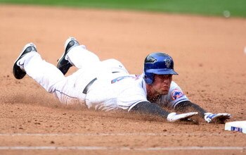 NEW YORK - APRIL 04:  Josh Thole #78 of the New York Mets dives back to first against the Boston Red Sox on April 4, 2009 at Citi Field in the Flushing neighborhood of the Queens borough of New York City. The Red Sox defeated the Mets 9-3.  (Photo by Jim 