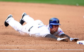NEW YORK - APRIL 04: Josh Thole #78 of the New York Mets dives back to first against the Boston Red Sox on April 4, 2009 at Citi Field in the Flushing neighborhood of the Queens borough of New York City. The Red Sox defeated the Mets 9-3. (Photo by Jim