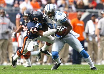 CHICAGO - NOVEMBER 02:  Wide receiver Calvin Johnson #81 of the Detroit Lions makes a reception and is brought down by Kevin Payne #44 of the Chicago Bears during the second quarter at Soldier Field on November 2, 2008 in Chicago, Illinois.  (Photo by Jef