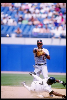4 Jun 1995:  Second baseman Lou Whitaker of the Detroit Tigers (standing) throws the ball during a game against the Chicago White Sox at Comiskey Park in Chicago, Illinois.  The Tigers won the game, 8-5. Mandatory Credit: Jonathan Daniel  /Allsport