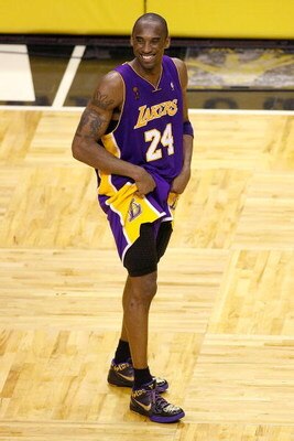 ORLANDO, FL - JUNE 14:  Kobe Bryant #24 of the Los Angeles Lakers smiles during the final moments of the Lakers' win over the Orlando Magic in Game Five of the 2009 NBA Finals on June 14, 2009 at Amway Arena in Orlando, Florida.  The Lakers won 99-86.  NO
