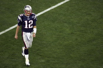 GLENDALE, AZ - FEBRUARY 03:  Tom Brady #12 of the New England Patriots walks off the field against the New York Giants in Super Bowl XLII on February 3, 2008 at the University of Phoenix Stadium in Glendale, Arizona.  (Photo by Jim McIsaac/Getty Images)