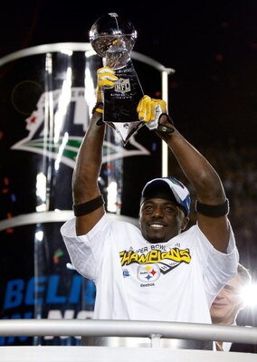 TAMPA, FL - FEBRUARY 01:  Super Bowl MVP Santonio Holmes #10 of the Pittsburgh Steelers celebrates with the Vince Lombardi trophy after their 27-23 win against the Arizona Cardinals during Super Bowl XLIII on February 1, 2009 at Raymond James Stadium in T