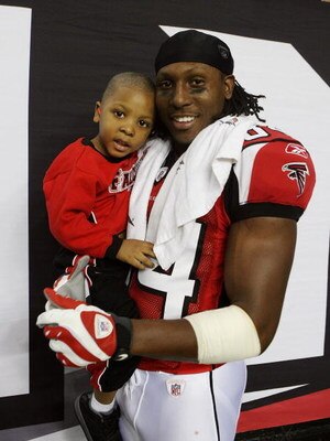 ATLANTA - DECEMBER 28:  Wide receiver Roddy White #84 of the Atlanta Falcons celebrates on the sidelines after defeating the St. Louis Rams at Georgia Dome on December 28, 2008 in Atlanta, Georgia.  The Falcons defeated the Rams 31-27.  (Photo by Doug Ben