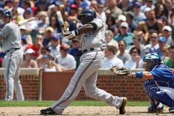 CHICAGO - JULY 03:  Mike Cameron #25 of the Milwaukee Brewers at bat against the Chicago Cubs during their MLB game on July 3, 2009 at Wrigley Field in Chicago, Illinois. (Photo by Jonathan Daniel/Getty Images) 
