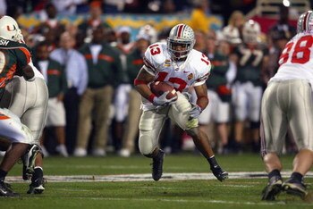 TEMPE, AZ - JANUARY 3:  Running back Maurice Clarett #13 of the Ohio State Buckeyes finds a hole against the University of Miami Hurricanes during the Tostitos Fiesta Bowl at Sun Devil Stadium on January 3, 2003 in Tempe, Arizona.  Ohio State won the game