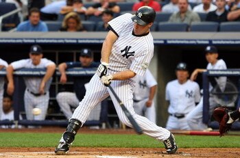 NEW YORK - JULY 20:  Mark Teixeira #25 of the New York Yankees connects for a first inning single against the Baltimore Orioles on July 20, 2009 at Yankee Stadium in the Bronx borough of New York City.  (Photo by Jim McIsaac/Getty Images)