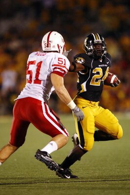 COLUMBIA, MO - OCTOBER 6:  Derrick Washington #24 of the Missouri Tigers stiff-arms Bo Ruud #51 of the Nebraska Cornhuskers during 2nd-half action on October 6, 2007 at Faurot Field in Columbia, Missouri.  Missouri won 41-6. (Photo by G. Newman Lowrance/G
