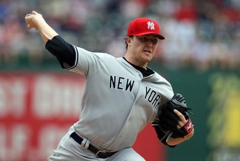 ARLINGTON, TX - MAY 25:  Pitcher Phil Hughes #65 of the New York Yankees throws against the Texas Rangers on May 25, 2009 at Rangers Ballpark in Arlington, Texas.  (Photo by Ronald Martinez/Getty Images)