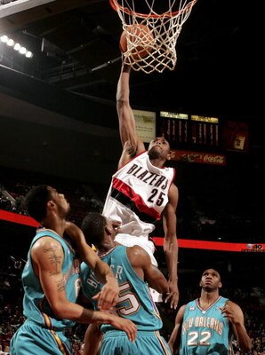 PORTLAND, OR - DECEMBER 27:  Travis Outlaw #25 of the Portland Trail Blazers attempts a dunk over Rasual Butler #45 of the New Orleans/Oklahoma City Hornets on December 27, 2006 at the Rose Garden in Portland, Oregon.  NOTE TO USER: User expressly acknowl