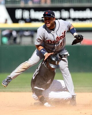 CHICAGO - JUNE 08: Placido Polanco #14 of the Detroit Tigers leaps over Alexei Ramirez #10 of the Chicago White Sox after turning a game-ending double play on June 8, 2009 at U.S. Cellular Field in Chicago, Illinois. The Tigers defeated the White Sox 5-4.
