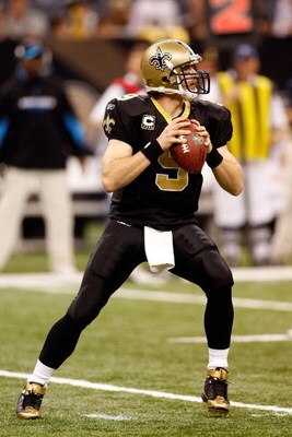 NEW ORLEANS - DECEMBER 28:  Quarterback Drew Brees #9 of the New Orleans Saints drops back to pass during the game against the Carolina Panthers on December 28, 2008 at the Superdome in New Orleans, Louisiana.  (Photo by Chris Graythen/Getty Images)