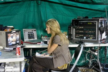 MIAMI, FL - SEPTEMBER 20: Commentator Erin Andrews of ESPN reports from the sidelines as the University of Miami Hurricanes host the Texas A&M Aggies at the Orange Bowl on September 20, 2007 in Miami, Florida.  Miami won 31-17.  (Photo by Al Messerschmidt