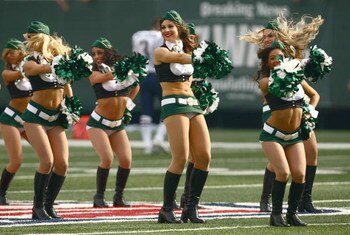 EAST RUTHERFORD, NJ - SEPTEMBER 14:  Cheerleaders of the New York Jets perform at midfield during a break in NFL game action against the New England Patriots on September 14, 2008 at the Meadowlands, East Rutherford, New Jersey. The Patriots defeated the 
