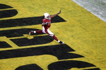 TAMPA, FL - FEBRUARY 01:  Wide receiver Larry Fitzgerald #11 of the Arizona Cardinals celebrates as after scoring a 64-yard touchdown reception in the fourth quarter against the Pittsburgh Steelers during Super Bowl XLIII on February 1, 2009 at Raymond Ja