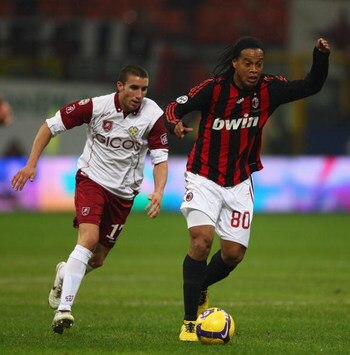 MILAN, ITALY - FEBRUARY 07:  Ronaldhino (right) of Milan and Antonino Barilla (left) during the Serie A match between AC Milan and Reggina at the San Siro stadium on February 7, 2009 in Milan,Italy.  (Photo by Michael Steele/Getty Images)