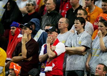 PARIS - MAY 17:  Arsenal fans look despondent after their teams defeat in the UEFA Champions League Final between Arsenal and Barcelona at the Stade de France on May 17, 2006 in Paris, France.  (Photo by Shaun Botterill/Getty Images)