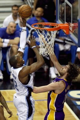 ORLANDO, FL - JUNE 9:  Dwight Howard #12 of the Orlando Magic goes to the basket against Pau Gasol #16 of the Los Angeles Lakers in Game Three of the 2009 NBA Finals on June 9, 2009 at Amway Arena in Orlando, Florida.  The Magic won 108-104.  NOTE TO USER