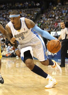 DENVER - MAY 25:  Carmelo Anthony #15 of the Denver Nuggets drives against the Los Angeles Lakers in Game Four of the Western Conference Finals during the 2009 NBA Playoffs at Pepsi Center on May 25, 2009 in Denver, Colorado. NOTE TO USER: User expressly 