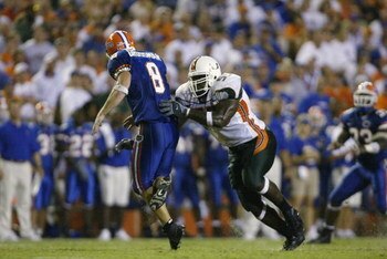 GAINESVILLE, FL - SEPTEMBER 7:  Defensive end Jamaal Green #55 of the University of Miami pressures quarterback Rex Grossman #8 of the University of Florida during the NCAA football game on September 7, 2002 at Florida Field in Gainesville, Florida.  Miam