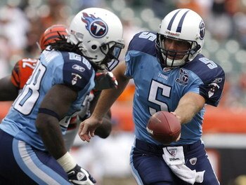 CINCINNATI - SEPTEMBER 14:  Kerry Collins #5 of the Tennessee Titans hands the ball off to Chris Johnson #28 against the Cincinnati Bengals during the third quarter of their NFL game September 14, 2008 at Paul Brown Stadium in Cincinnati, Ohio. The Titans