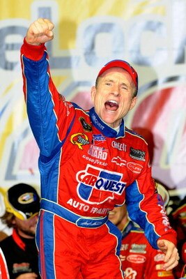 JOLIET, IL - JULY 11:  Mark Martin, driver of the #5 CARQUEST/Kellogg's Chevrolet, celebrates in victory lane after winning the NASCAR Sprint Cup Series LifeLock.com 400 at Chicagoland Speedway on July 11, 2009 in Joliet, Illinois.  (Photo by John Harrels