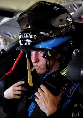 DAYTONA BEACH, FL - JULY 02:  Denny Hamlin, driver of the #11 FedEx Office Toyota prepares to drive during practice for the NASCAR Sprint Cup Series Coke Zero 400 at Daytona International Speedway on July 2, 2009 in Daytona Beach, Florida.  (Photo by Rust