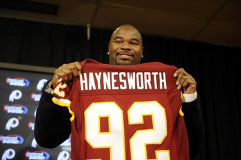 ASHBURN, VA - FEBRUARY 27: Albert Haynesworth posese with his new jersey at a press conference after signing a 7-year contract worth approximately $100 million with the Washington Redskins on February 27, 2009 at Redskins Park in Ashburn, Virginia. (Pho