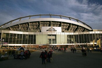 DENVER - JANUARY 14:  Fans walk outside of Invesco Field at Mile High before the AFC Divisional Playoff game between the New England Patriots and the Denver Broncoson January 14, 2006 at in Denver, Colorado.  (Photo by Ronald Martinez/Getty Images)