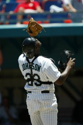 MIAMI - APRIL 28 :  Catcher Charles Johnson #23 of the Florida Marlins stares into the sun for a pop up during the MLB game against the Arizona Diamondbacks at Pro Player Stadium in Miami, Florida on April 28, 2002.  The Diamondbacks won 5-4. (Photo by El