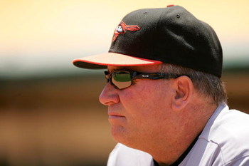 OAKLAND, CA - JUNE 07:  Baltimore Orioles manager Dave Trembley stands in the dugout before their game against the Oakland Athletics at the Oakland Coliseum on June 7, 2009 in Oakland, California.  (Photo by Ezra Shaw/Getty Images)