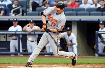 NEW YORK - JULY 20:  Aubrey Huff #17 of the Baltimore Orioles bats against the New York Yankees on July 20, 2009 at Yankee Stadium in the Bronx borough of New York City.  (Photo by Jim McIsaac/Getty Images)
