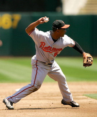 OAKLAND, CA - JUNE 07:  Melvin Mora #6 of the Baltimore Orioles throws to first base during their game against the Oakland Athletics at the Oakland Coliseum on June 7, 2009 in Oakland, California.  (Photo by Ezra Shaw/Getty Images)