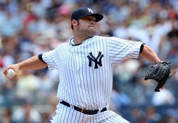 NEW YORK - JULY 19:  Joba Chamberlain #62 of the New York Yankees pitches against the Detroit Tigers on July 19, 2009 at Yankee Stadium in the Bronx borough of New York City.  (Photo by Jim McIsaac/Getty Images)