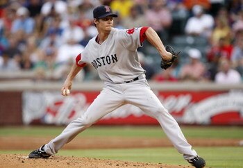 ARLINGTON, TX - JULY 22:  Clay Buchholz #61 of the Boston Red Sox pitches against the Texas Rangers during the game at Rangers Ballpark July 22, 2009 in Arlington, Texas.  (Photo by Ronald Martinez/Getty Images)