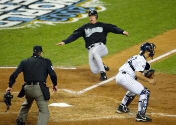 BRONX, NY - OCTOBER 25:  Jeff Conine #18 of the Florida Marlins scores on a sacrifice fly by teammate Juan Encarnacion #43 in the sixth inning against the New York Yankees during game six of the Major League Baseball World Series on October 25, 2003 at Ya
