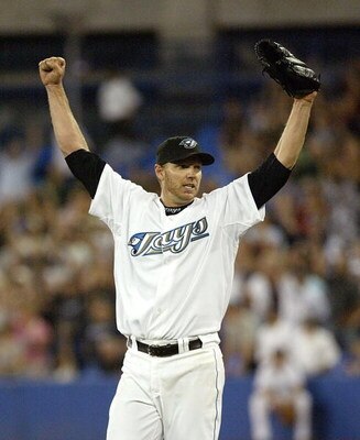 TORONTO - AUGUST 14:  Roy Halladay #32 of the Toronto Blue Jays celebrates his complete game win against the Los Angeles Angels of Anaheim on August 14, 2007 at the Rogers Centre in Toronto, Ontario, Canada.  (Photo by Dave Sandford/Getty Images)
